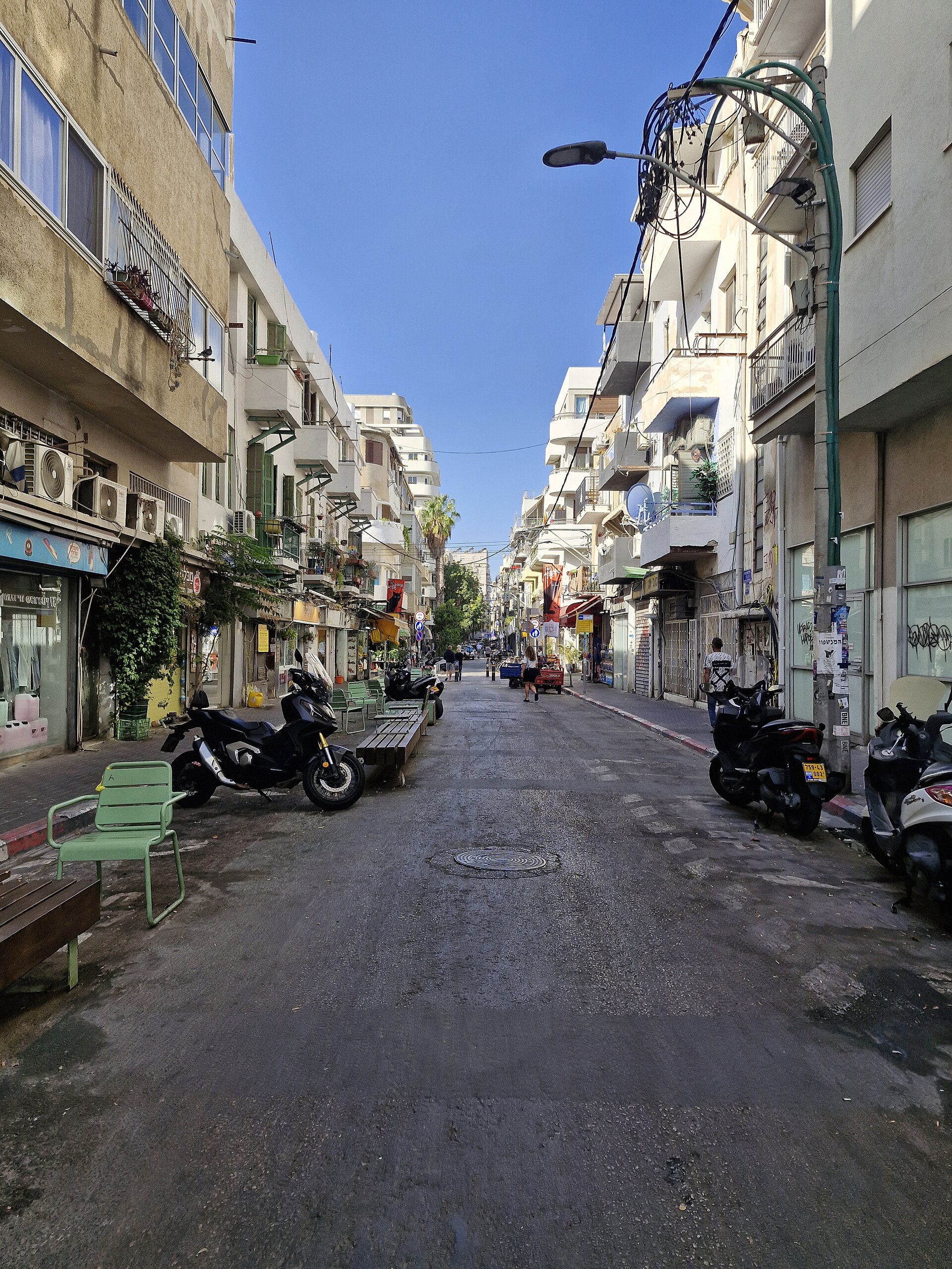 A pedestrian street with cafés and buildings in Florentin, Tel Aviv
